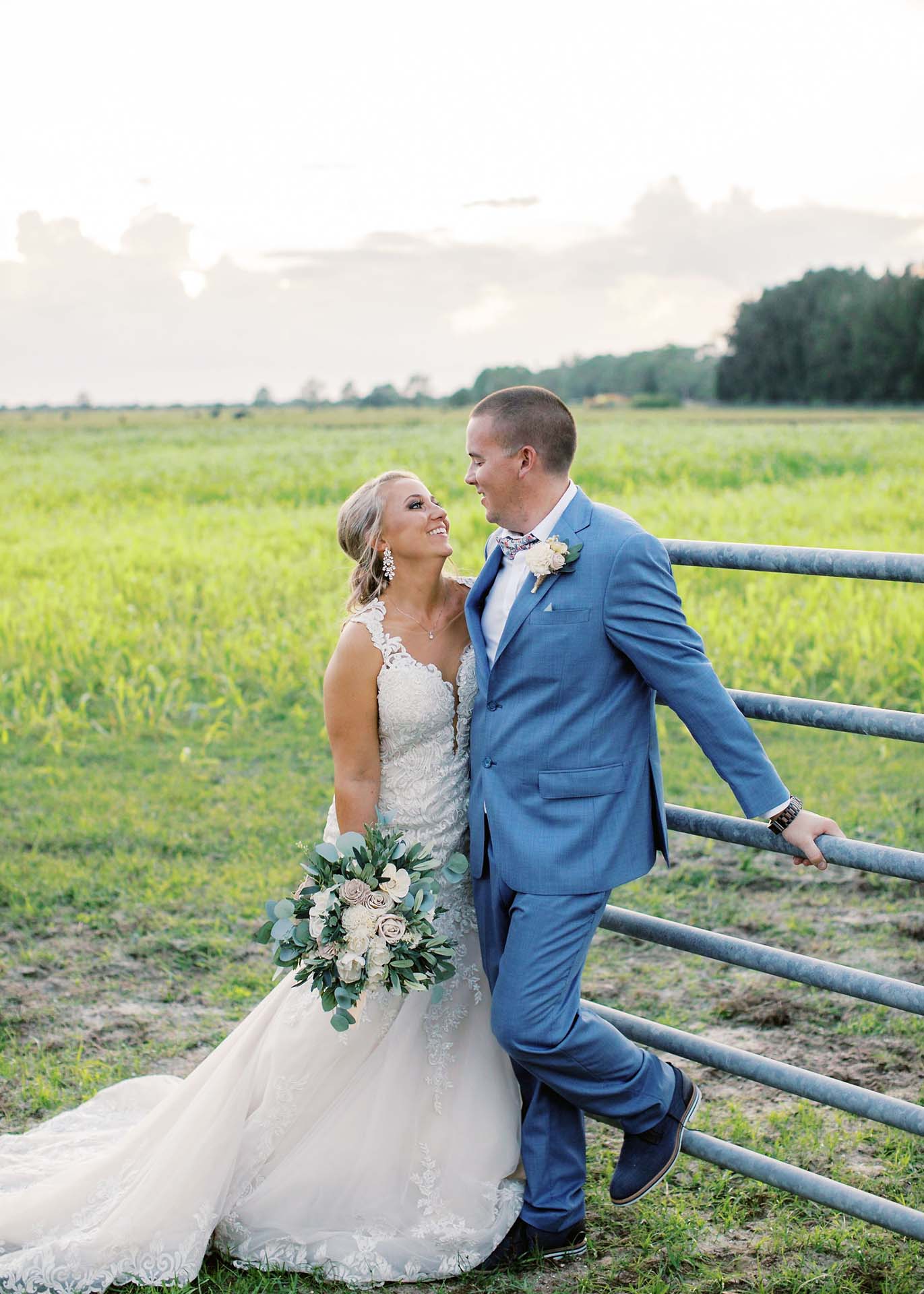 Masters Stables wedding venue barn ranch-2. Bride and groom rustic field